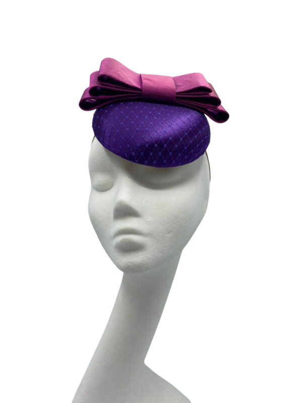 Cadbury purple satin hat with purple satin bow.